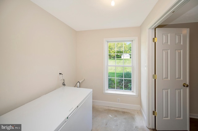 laundry area with baseboards and laundry area