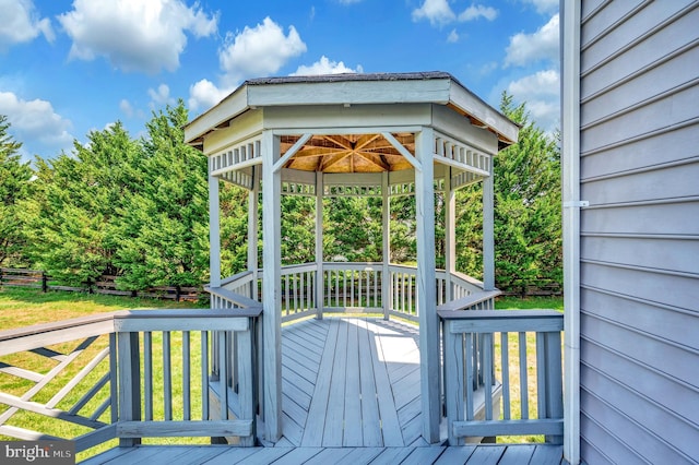 deck with a gazebo and a yard