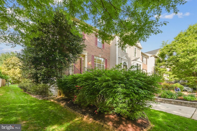 view of home's exterior featuring a lawn