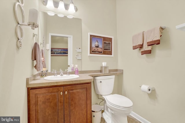 half bath with vanity and toilet