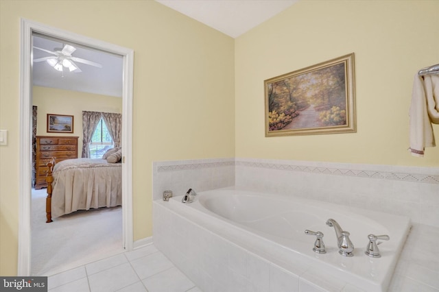 ensuite bathroom with a garden tub, a ceiling fan, tile patterned flooring, and ensuite bath