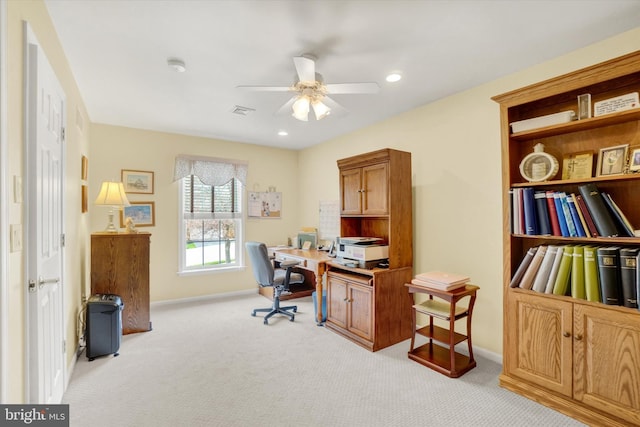 home office featuring visible vents, light carpet, baseboards, recessed lighting, and a ceiling fan