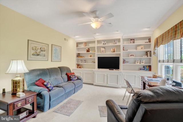 carpeted living room featuring a ceiling fan and visible vents