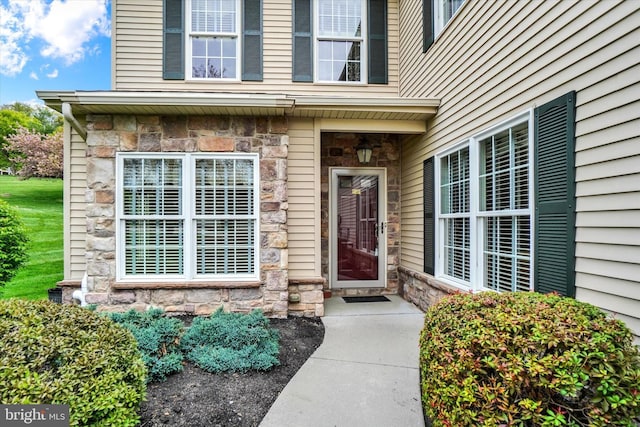 view of exterior entry with stone siding