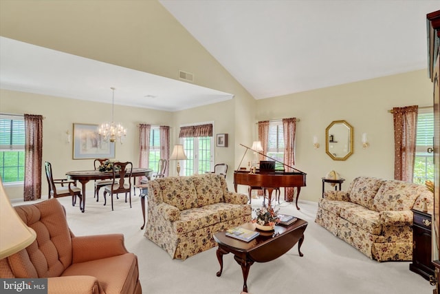living room with an inviting chandelier, light carpet, visible vents, and plenty of natural light