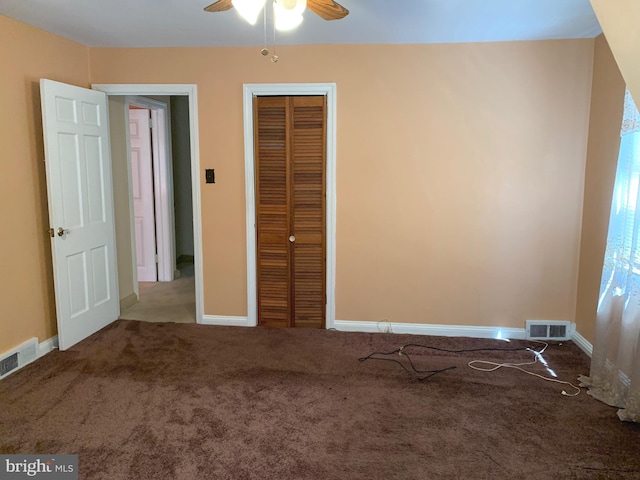 unfurnished bedroom featuring carpet floors, a closet, and baseboards