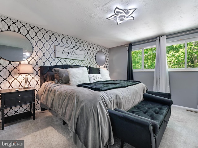 331 Possum Ct, Capitol Heights, MD 20743 - carpeted bedroom with visible vents, baseboards, an accent wall, and multiple windows