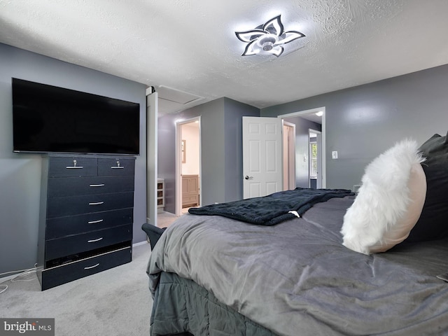 331 Possum Ct, Capitol Heights, MD 20743 - carpeted bedroom with baseboards, ensuite bath, and a textured ceiling