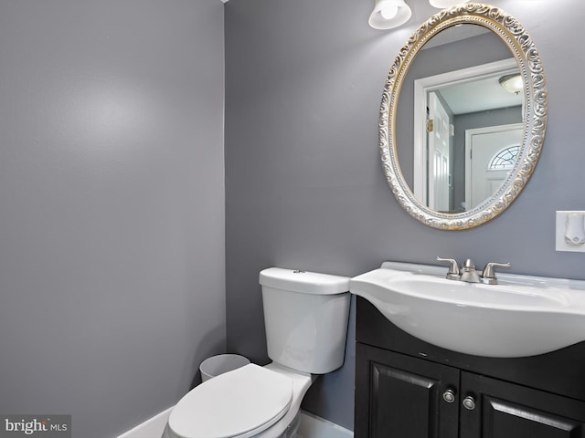 331 Possum Ct, Capitol Heights, MD 20743 - half bath with vanity, baseboards, and toilet