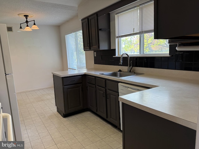 492 Delair Rd Unit C, Monroe, NJ 08831 - kitchen with a peninsula, backsplash, light countertops, and a sink