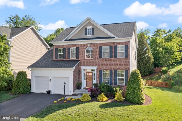 14401 Broadwinged Dr, Gainesville, VA 20155 - view of front facade featuring roof with shingles, asphalt driveway, a garage, and brick siding