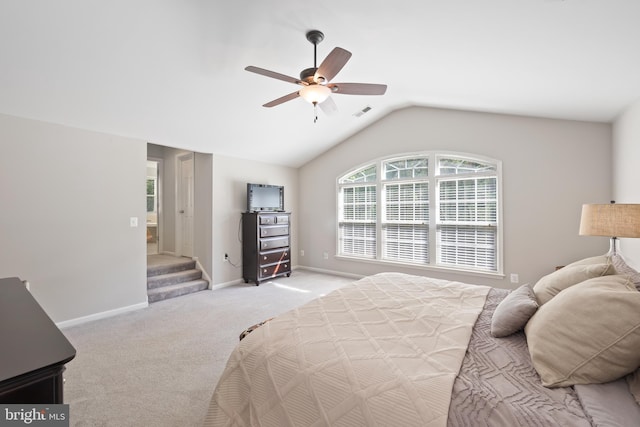 14401 Broadwinged Dr, Gainesville, VA 20155 - bedroom featuring light colored carpet, baseboards, vaulted ceiling, and a ceiling fan