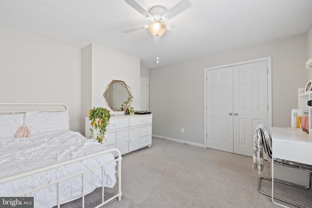 14401 Broadwinged Dr, Gainesville, VA 20155 - bedroom with light carpet, a closet, ceiling fan, and baseboards