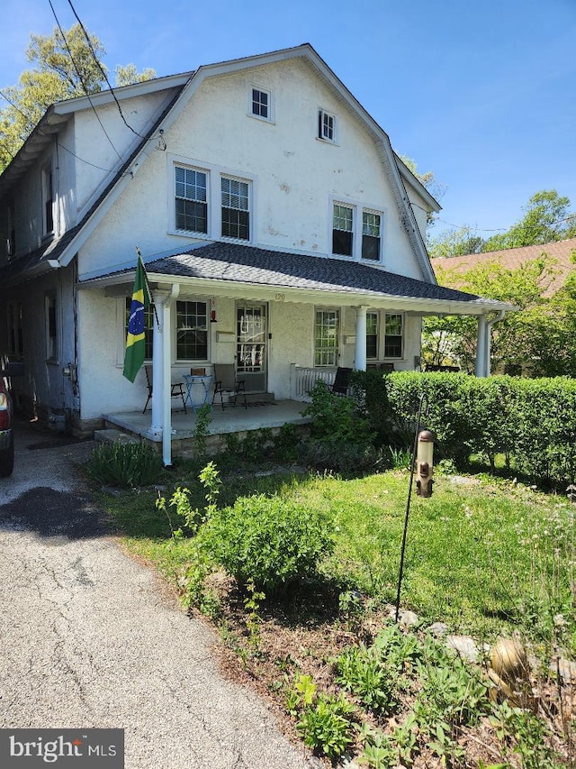 120 Biddle Rd, Paoli, PA 19301 - view of front of house featuring a porch, a gambrel roof, and stucco siding