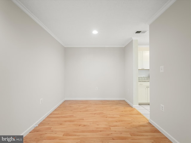 21019 Timber Ridge Ter Unit 102, Ashburn, VA 20147 - spare room featuring crown molding, light wood-type flooring, recessed lighting, and baseboards