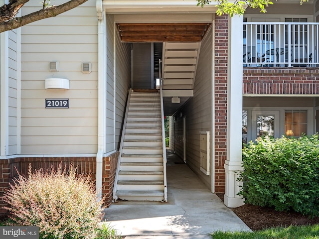 21019 Timber Ridge Ter Unit 102, Ashburn, VA 20147 - doorway to property with brick siding