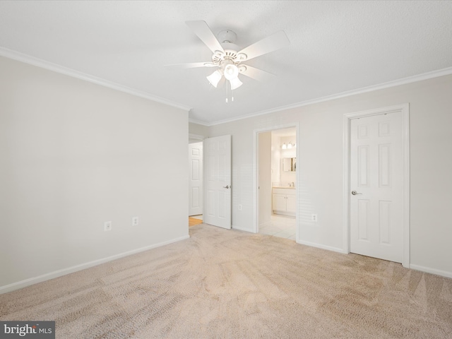 21019 Timber Ridge Ter Unit 102, Ashburn, VA 20147 - unfurnished bedroom with ornamental molding, carpet, baseboards, ensuite bathroom, and ceiling fan
