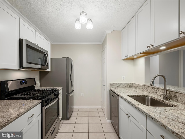 21019 Timber Ridge Ter Unit 102, Ashburn, VA 20147 - kitchen featuring stainless steel appliances, a sink, white cabinetry, a textured ceiling, and ornamental molding