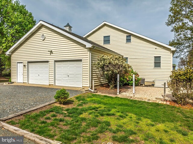 9050 Point Ln, Chestertown, MD 21620 - view of front of home with central AC, gravel driveway, and a front yard
