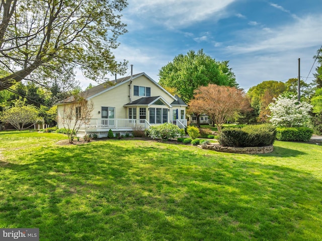 9050 Point Ln, Chestertown, MD 21620 - rear view of house featuring a lawn and a wooden deck