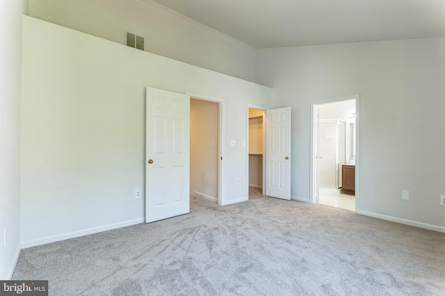 46878 Graham Cv, Sterling, VA 20165 - unfurnished bedroom featuring ensuite bathroom, carpet, visible vents, a spacious closet, and baseboards