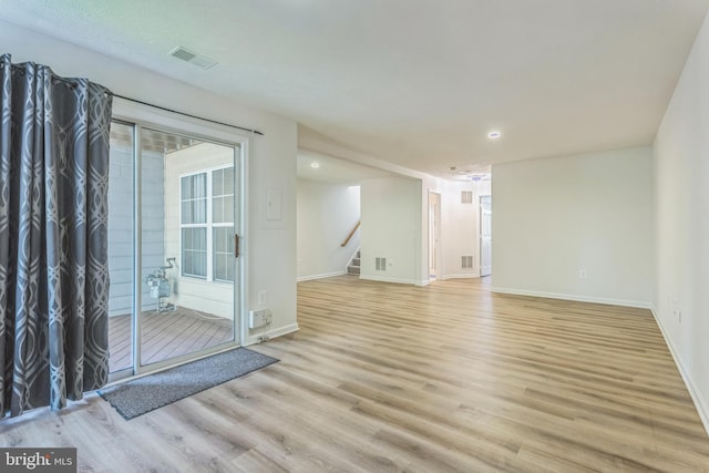 46878 Graham Cv, Sterling, VA 20165 - interior space featuring visible vents, light wood-style flooring, baseboards, and stairway