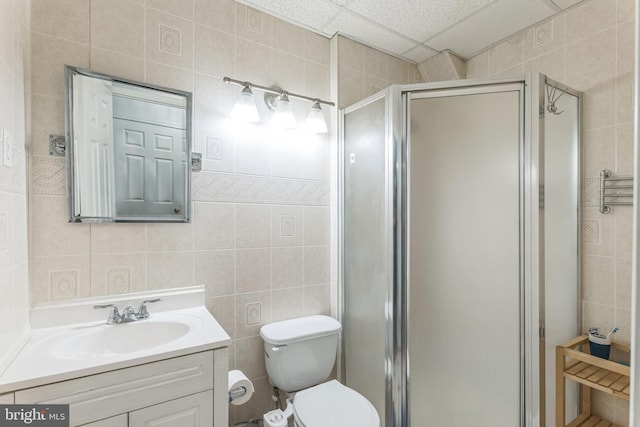 46878 Graham Cv, Sterling, VA 20165 - full bath featuring toilet, a stall shower, tile walls, visible vents, and vanity