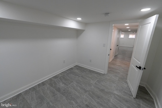 below grade area featuring recessed lighting and baseboards