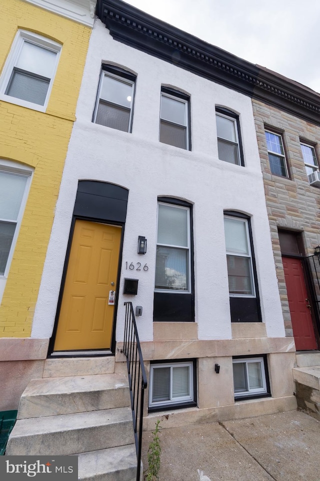 view of front of property with entry steps