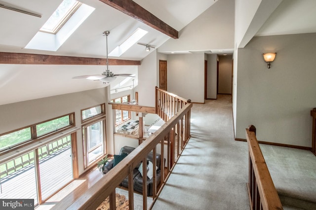 16 Hunters Ln, Chadds Ford, PA 19317 - hall featuring a skylight, high vaulted ceiling, beamed ceiling, an upstairs landing, and carpet