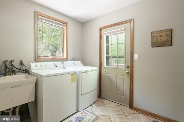16 Hunters Ln, Chadds Ford, PA 19317 - washroom with laundry area, a sink, baseboards, separate washer and dryer, and light tile patterned flooring