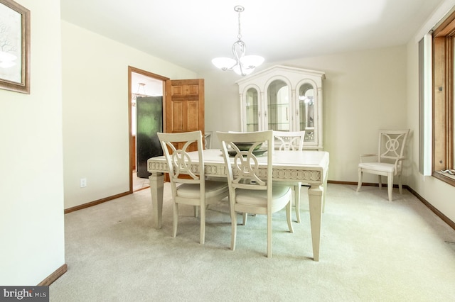 16 Hunters Ln, Chadds Ford, PA 19317 - dining room with baseboards, a notable chandelier, light carpet, and a wealth of natural light