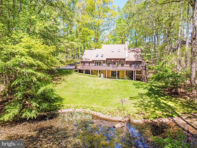 16 Hunters Ln, Chadds Ford, PA 19317 - rear view of property with stairs, a shingled roof, a deck, a chimney, and a yard