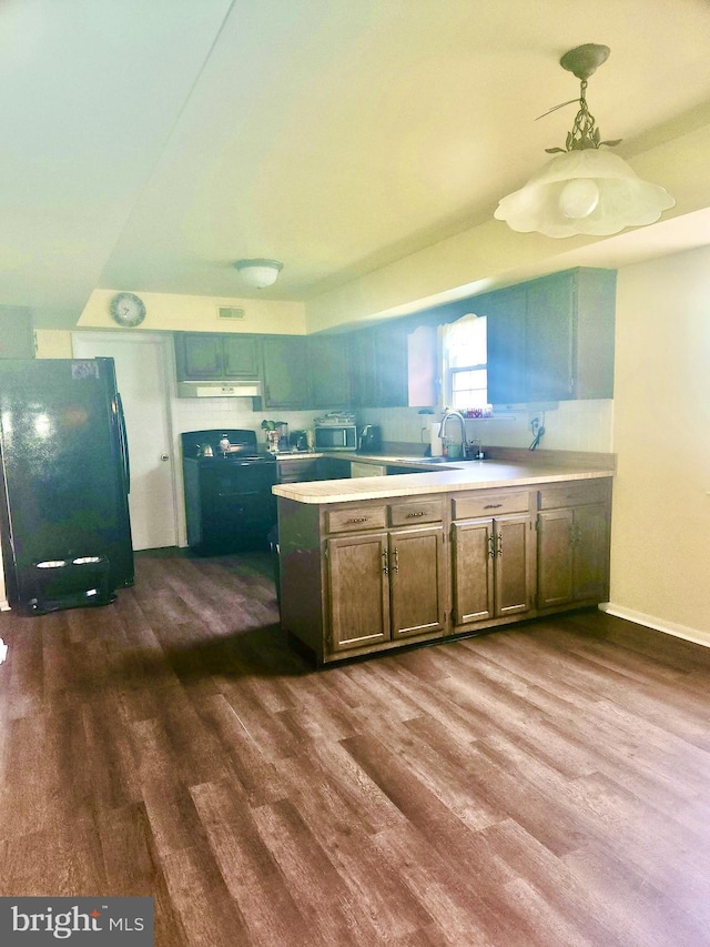 2 King William Ct, Sewell, NJ 08080 - kitchen featuring freestanding refrigerator, stainless steel microwave, dark wood-style floors, range, and under cabinet range hood