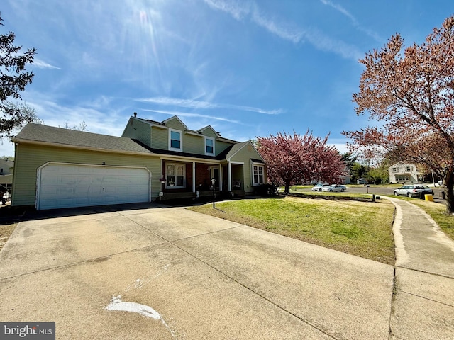 2 King William Ct, Sewell, NJ 08080 - traditional-style house featuring a front lawn, a porch, a garage, and driveway