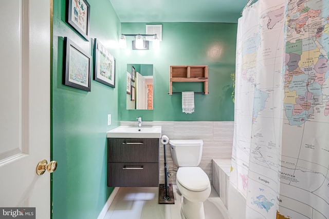 full bath featuring tile walls, toilet, vanity, a shower with curtain, and tile patterned flooring