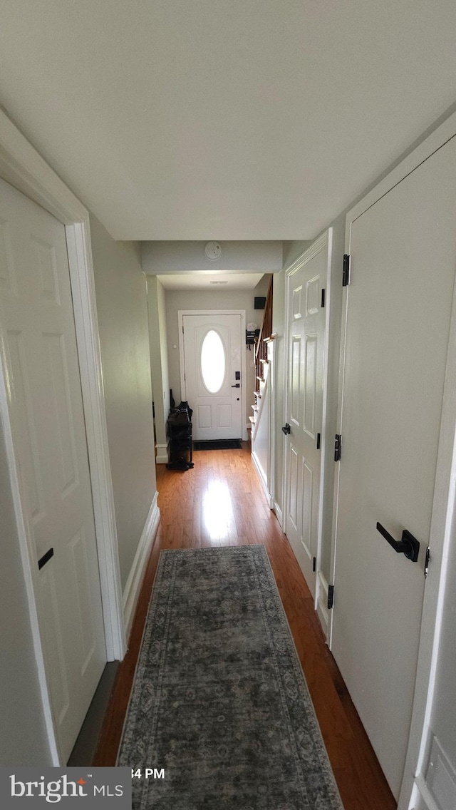 218 Stevenson Sq, Alexandria, VA 22304 - entryway with wood finished floors and stairs