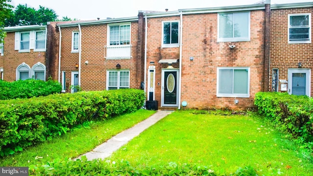 218 Stevenson Sq, Alexandria, VA 22304 - townhome / multi-family property with a front lawn and brick siding