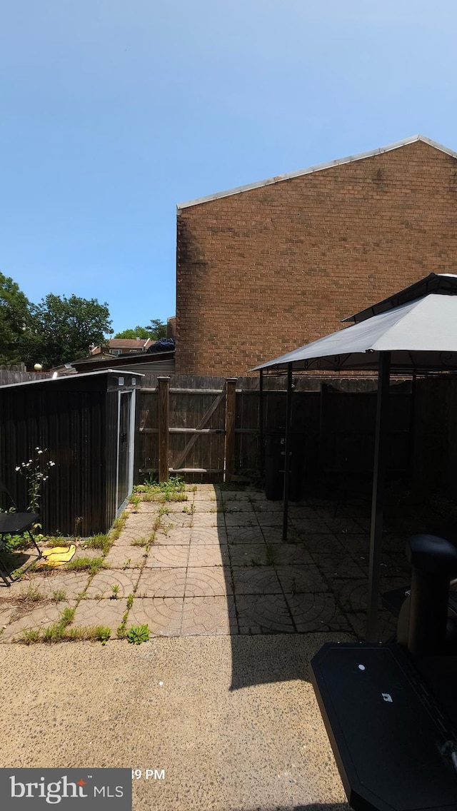 218 Stevenson Sq, Alexandria, VA 22304 - view of patio with a gate and a gazebo