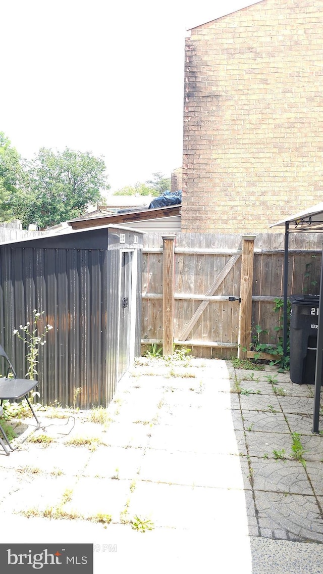 218 Stevenson Sq, Alexandria, VA 22304 - view of patio / terrace featuring a gate