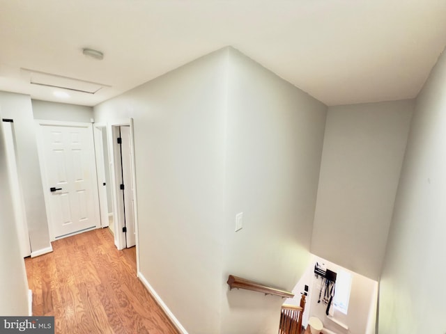 218 Stevenson Sq, Alexandria, VA 22304 - hallway featuring light wood-style floors, attic access, and an upstairs landing