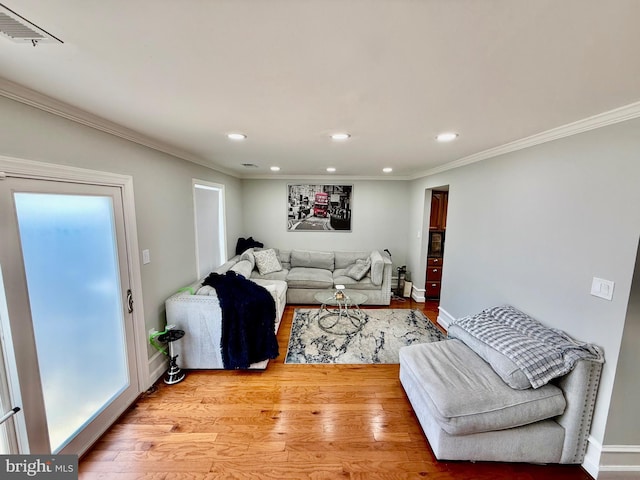 218 Stevenson Sq, Alexandria, VA 22304 - living area featuring light wood finished floors, recessed lighting, and crown molding