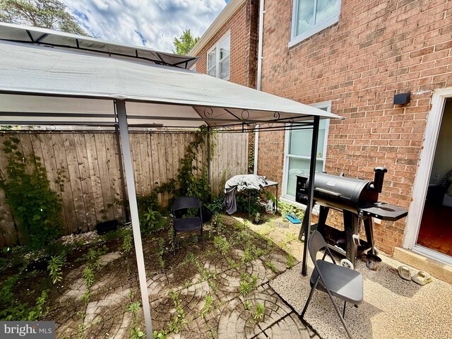 218 Stevenson Sq, Alexandria, VA 22304 - view of patio featuring a gazebo and a grill