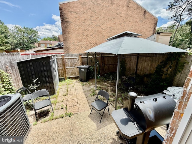 218 Stevenson Sq, Alexandria, VA 22304 - fenced backyard with area for grilling and a patio area