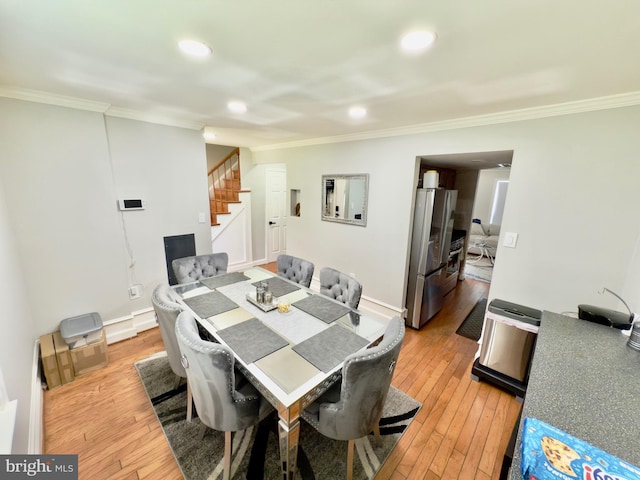 218 Stevenson Sq, Alexandria, VA 22304 - dining room with stairway, ornamental molding, light wood-style floors, and recessed lighting