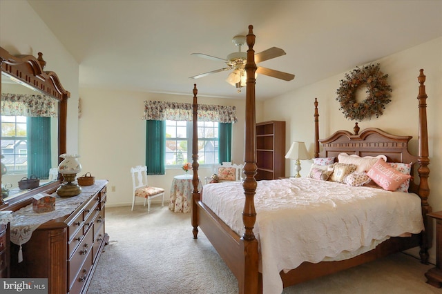 bedroom with baseboards, light colored carpet, and ceiling fan