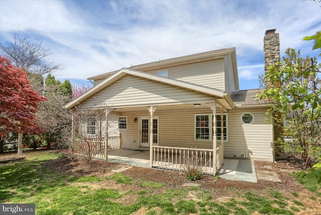 back of property featuring a patio area