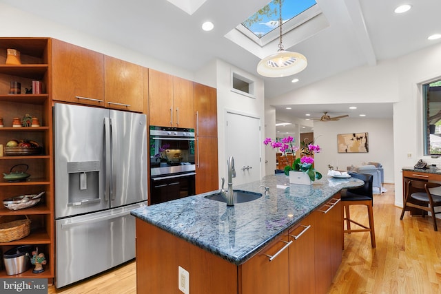 3440 Mansfield Rd, Falls Church, VA 22041 - kitchen with appliances with stainless steel finishes, a sink, a skylight, open shelves, and light wood-style flooring