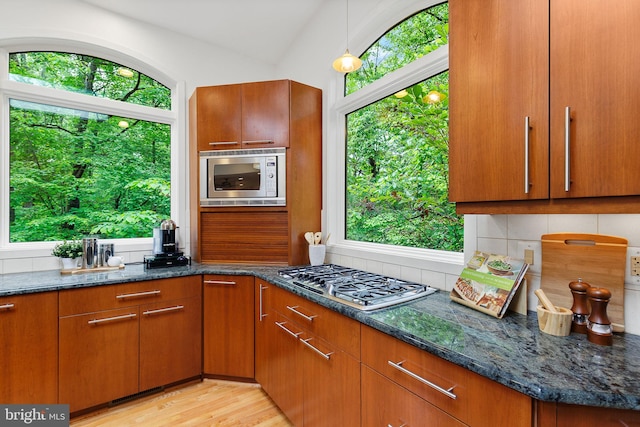 3440 Mansfield Rd, Falls Church, VA 22041 - kitchen with appliances with stainless steel finishes, dark stone countertops, and brown cabinets