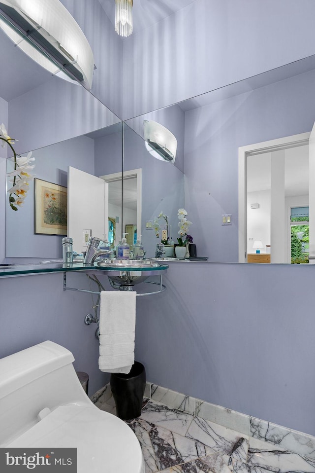 3440 Mansfield Rd, Falls Church, VA 22041 - bathroom featuring marble look tiles and toilet